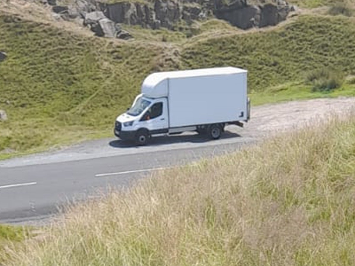 Removal van on the road en route to a job